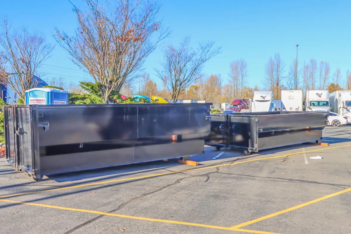 Professional dumpster rental service with roll-off container on residential driveway in Yorkville